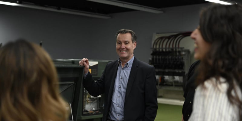 CEO Anders Sjoelin smiles while giving a product presentation to customers 