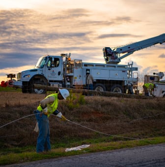 Alabama Power crews work to restore power in a rural area