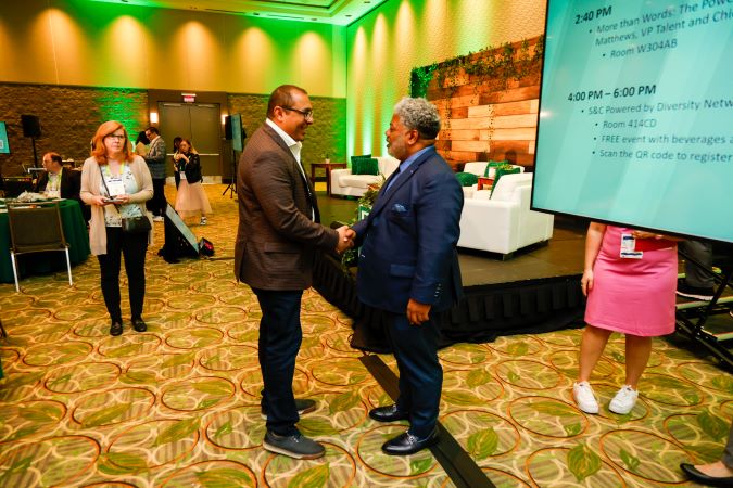 Men shaking hands at the Powered by Diversity Lunch